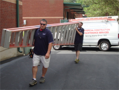 John and Kevin deploying large ladder.